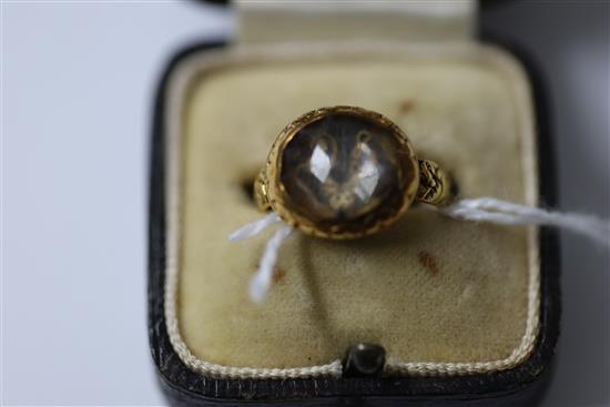 A late 17th century gold and Stuart crystal memento mori ring, size J.